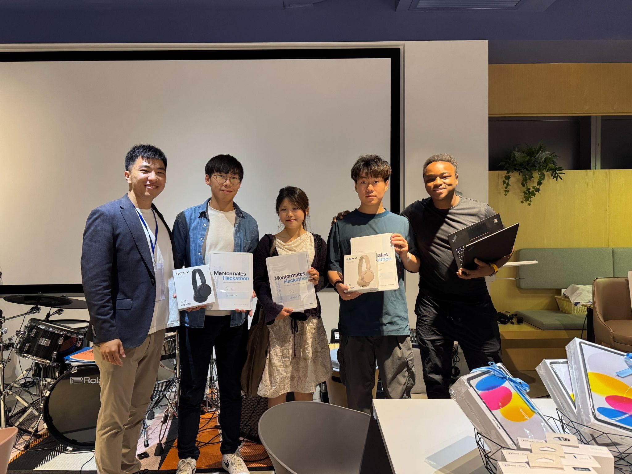 A winning team receiving prizes at the MentorMates Goodnotes Hackathon