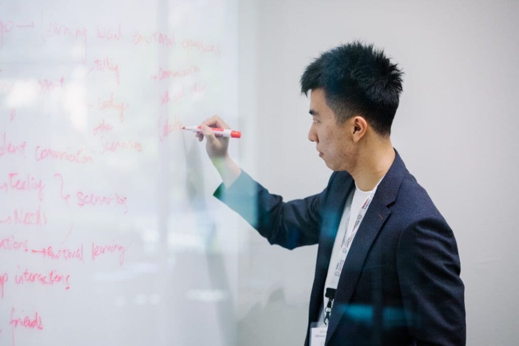 A facilitator maps ideas during Stanford's inclusive AI hackathon